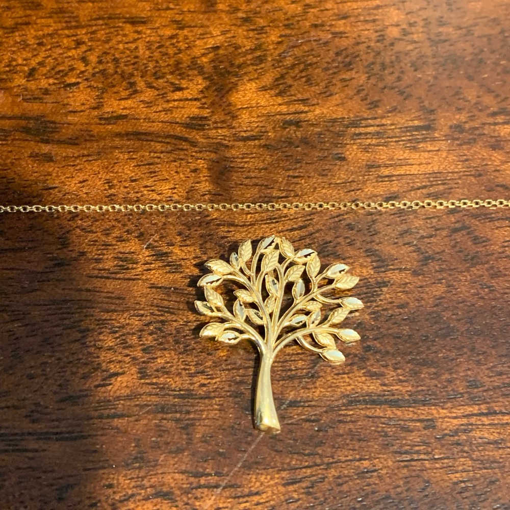 14K yellow gold tree charm on a 10K yellow gold 18” chain.